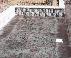 Seamless textured concrete pool deck with ashlar slate.