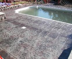 Stamped pool deck with seamless texture inlay.