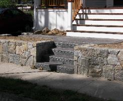 Stone wall with seamless textured concrete.