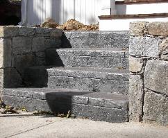 Stone wall and stamped concrete steps