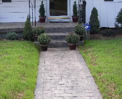Large cobblestone stamped concrete walk.