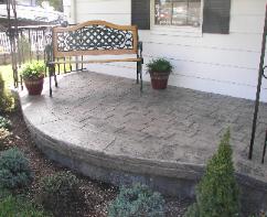 Large cobble stone stamped concrete porch.