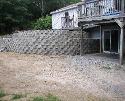 Interlock wall and stamped concrete patios.